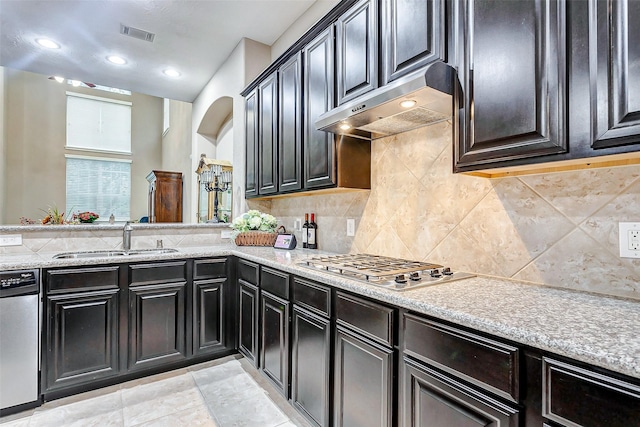 kitchen featuring tasteful backsplash, stainless steel appliances, and sink