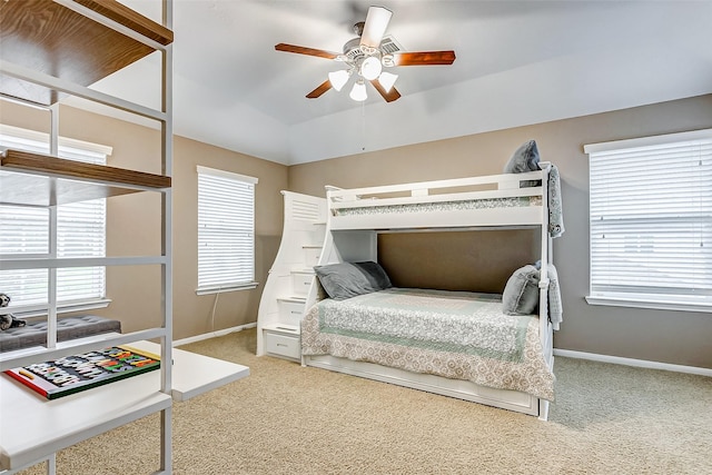 bedroom featuring lofted ceiling, ceiling fan, and carpet flooring