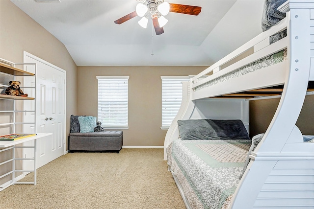 bedroom featuring ceiling fan, light colored carpet, and lofted ceiling