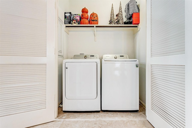 washroom with washing machine and dryer