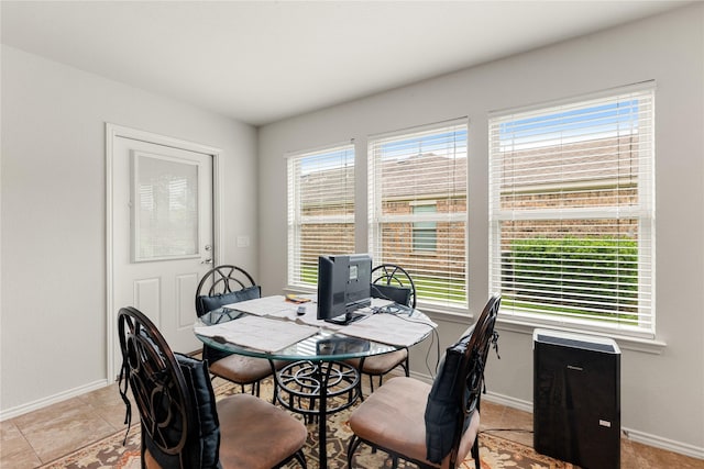 dining space featuring plenty of natural light