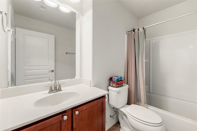 full bathroom with shower / tub combo with curtain, vanity, and toilet