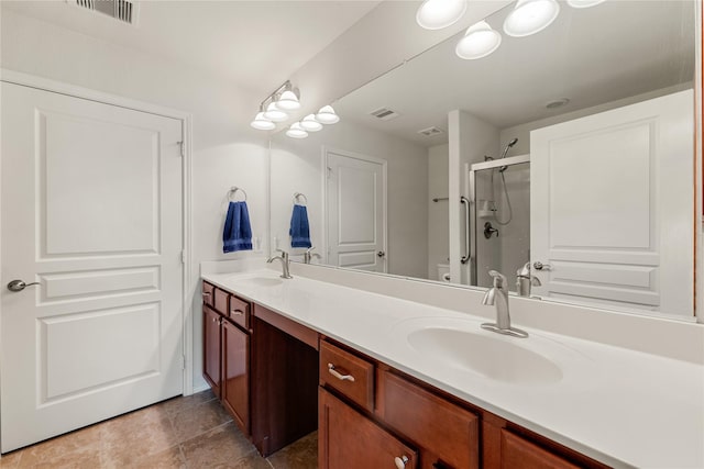 bathroom with vanity and an enclosed shower