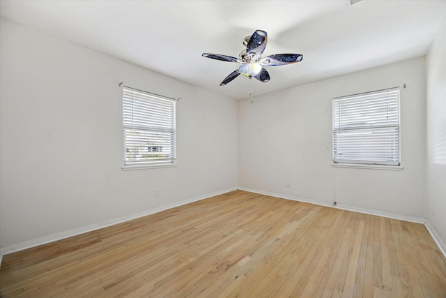 unfurnished room with ceiling fan and light wood-type flooring