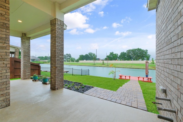 view of patio / terrace featuring a water view