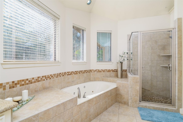 bathroom with plus walk in shower and tile patterned flooring