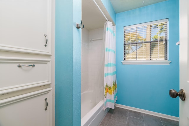 bathroom featuring tile patterned floors and shower / bath combo