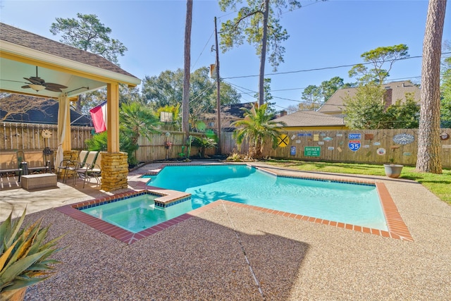 view of pool with a hot tub, a patio, an outdoor living space, and ceiling fan