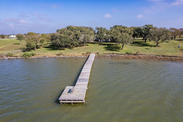 dock area featuring a water view and a yard