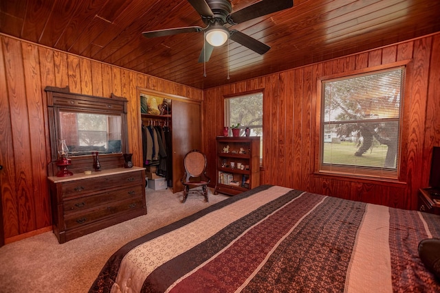 bedroom featuring wood ceiling and wood walls