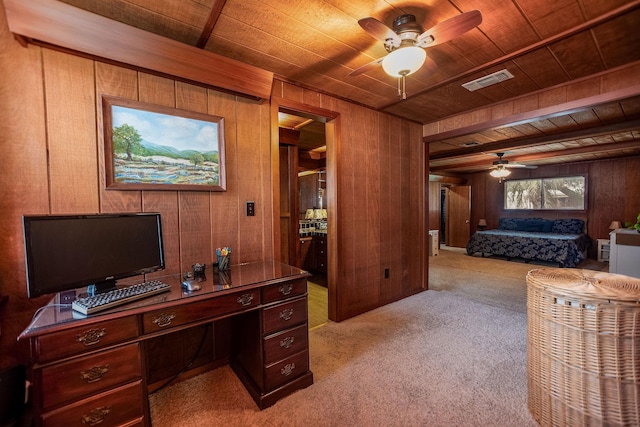 office featuring ceiling fan, light carpet, wooden ceiling, and wooden walls