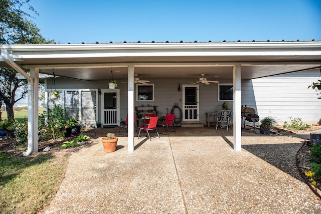 back of house with ceiling fan and a patio