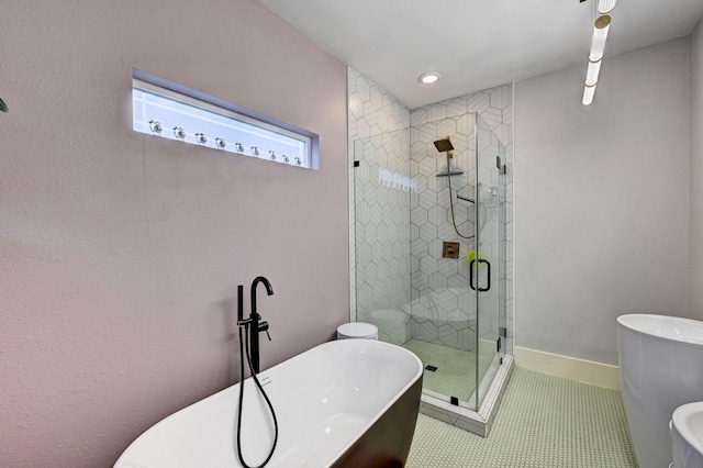 bathroom with tile patterned flooring and independent shower and bath