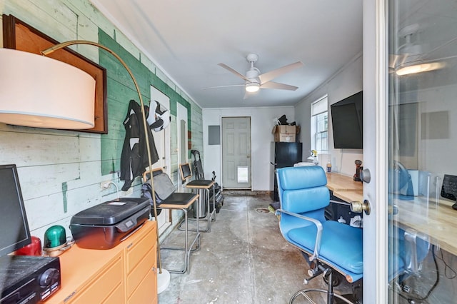 office with crown molding, ceiling fan, and concrete floors