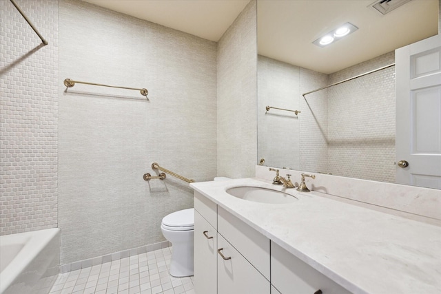 bathroom with vanity, toilet, and tile patterned flooring