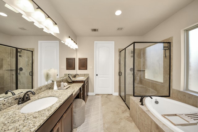 bathroom with independent shower and bath and vanity