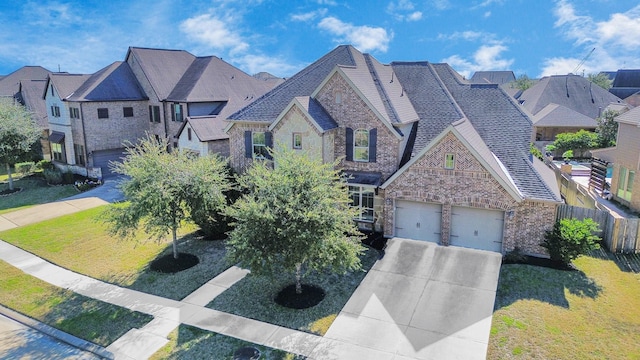 view of front facade featuring a garage and a front lawn