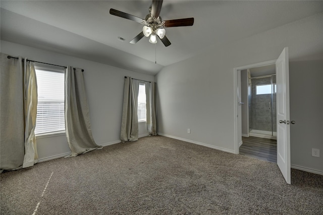 carpeted empty room with ceiling fan and lofted ceiling