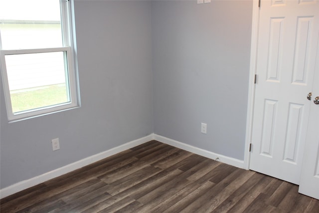 unfurnished room featuring dark hardwood / wood-style floors