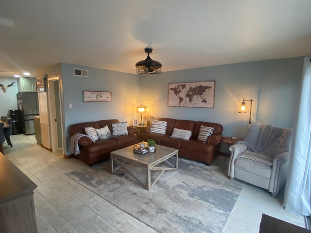 living room with light hardwood / wood-style floors