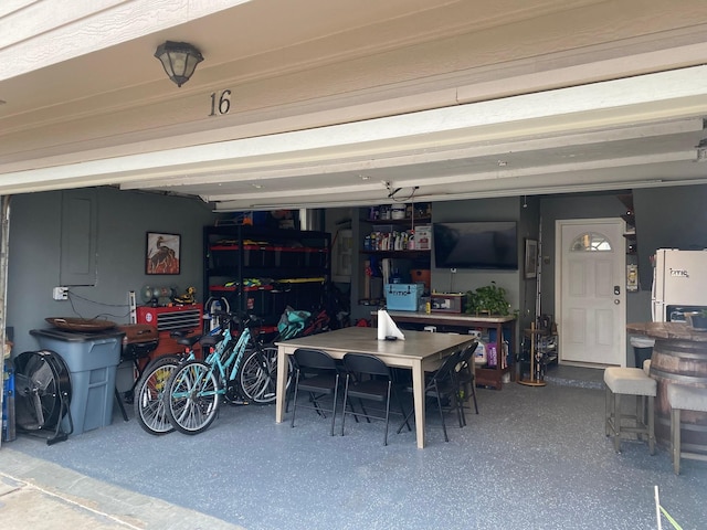 garage featuring white fridge