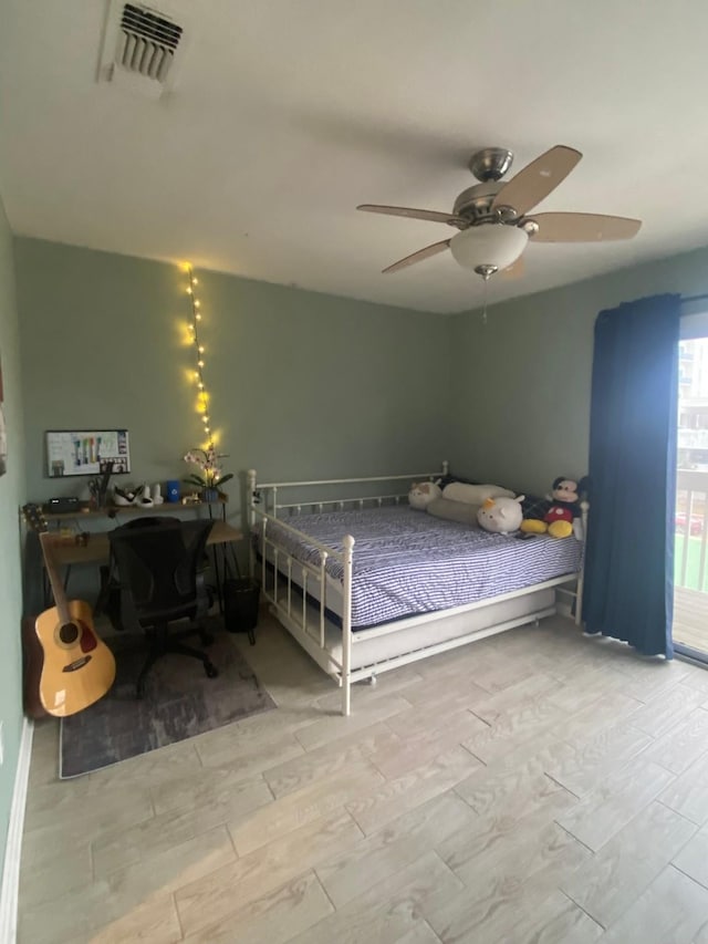 bedroom featuring ceiling fan and light hardwood / wood-style flooring