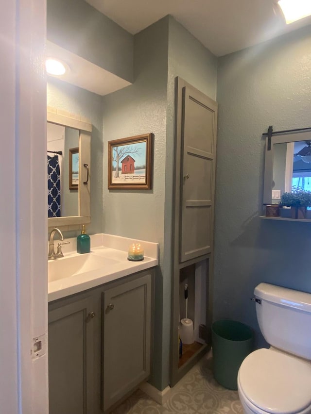 bathroom with vanity and toilet