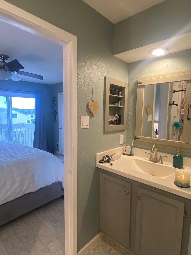 bathroom featuring ceiling fan, vanity, and hardwood / wood-style floors