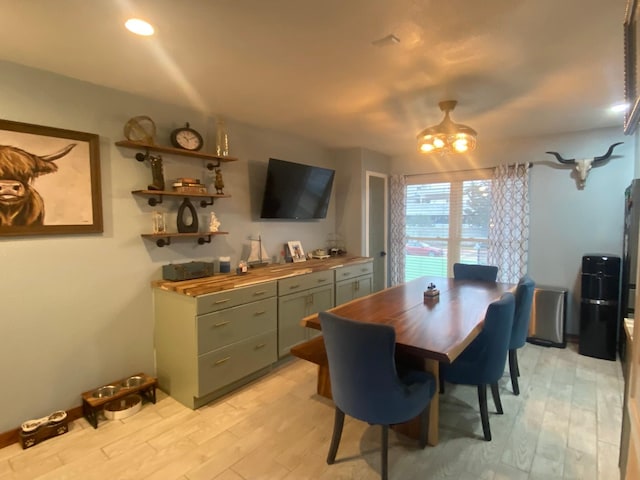 dining area featuring light wood-type flooring