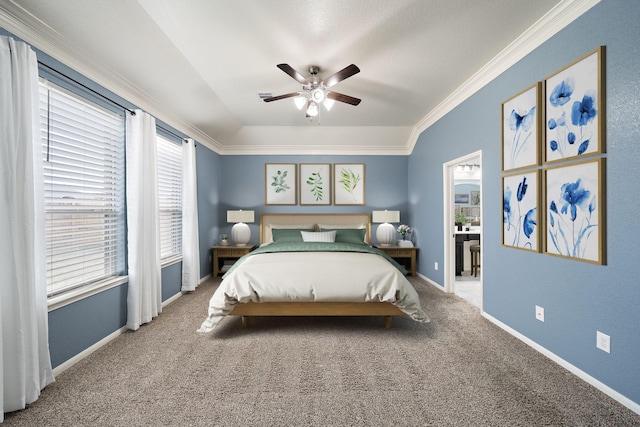 carpeted bedroom featuring ornamental molding and ceiling fan