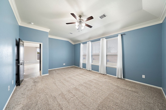 interior space with ornamental molding, carpet, and ceiling fan