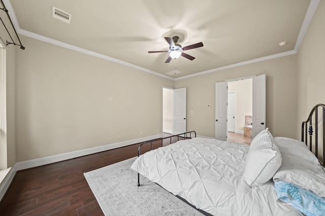 bedroom with ornamental molding, dark hardwood / wood-style floors, and ceiling fan