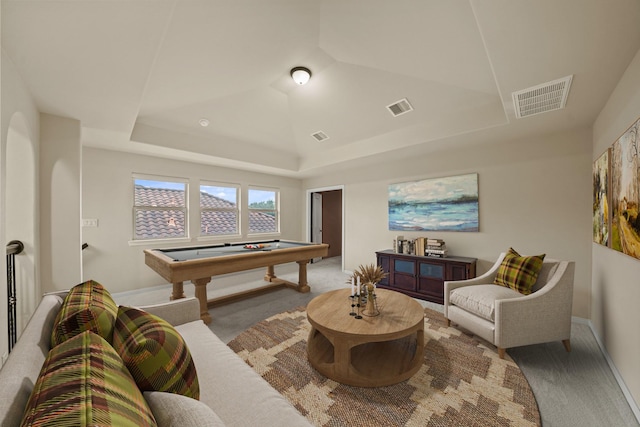 recreation room featuring a tray ceiling, carpet floors, and billiards