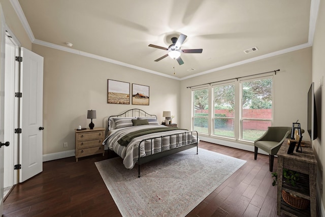 bedroom with ceiling fan, ornamental molding, and dark hardwood / wood-style flooring