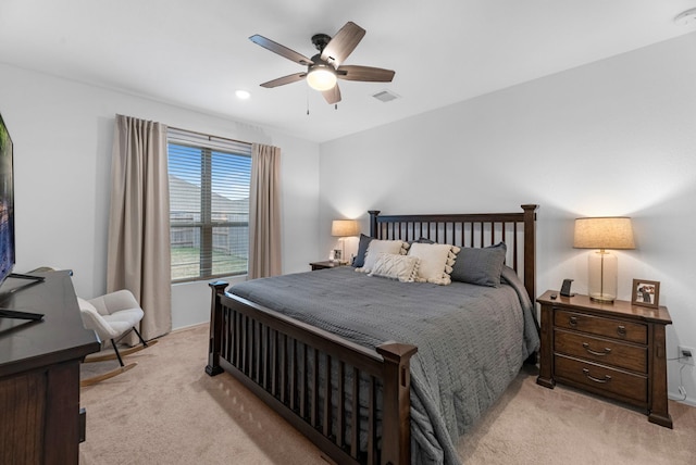 bedroom featuring ceiling fan and light carpet