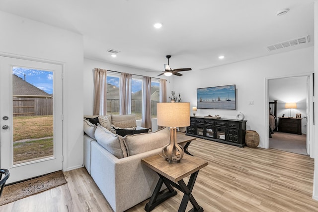 living room featuring hardwood / wood-style flooring and ceiling fan