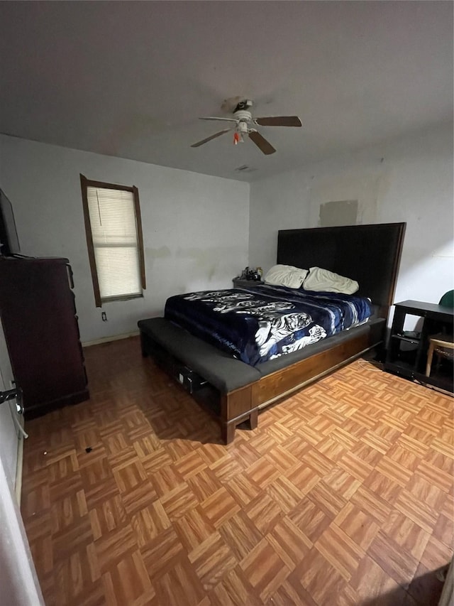 bedroom featuring ceiling fan and light parquet floors