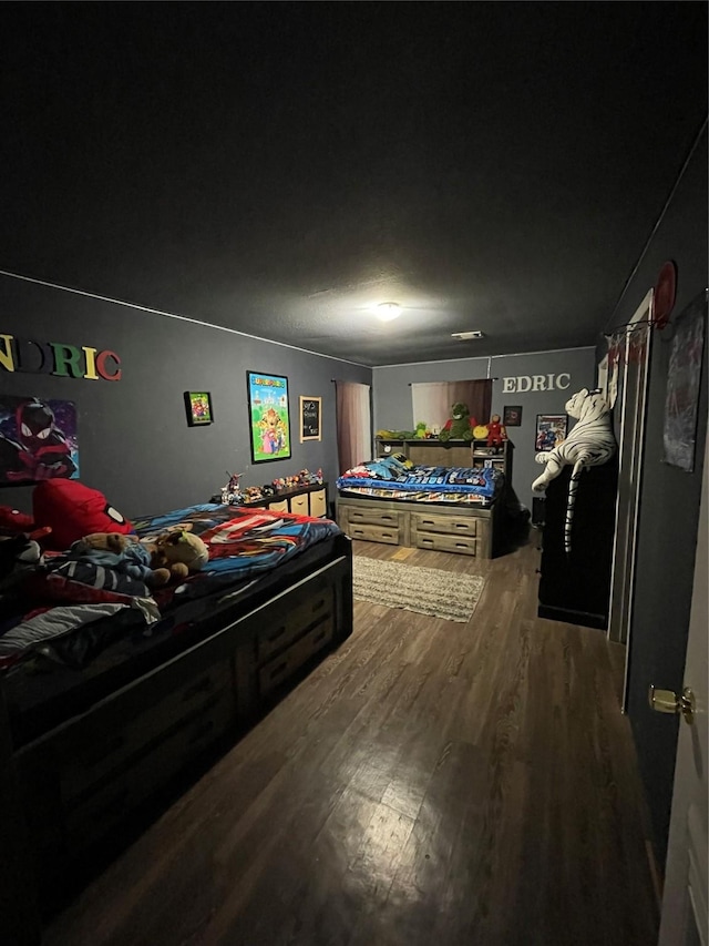 bedroom featuring dark hardwood / wood-style floors