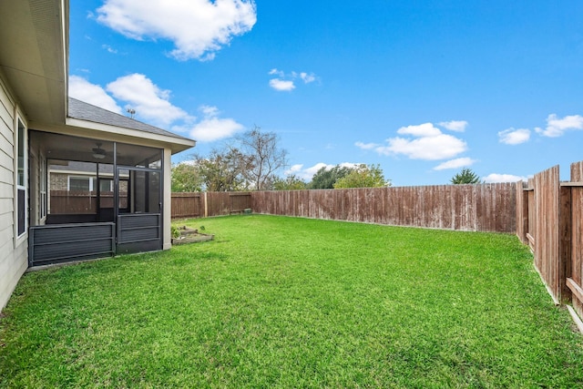 view of yard with a sunroom