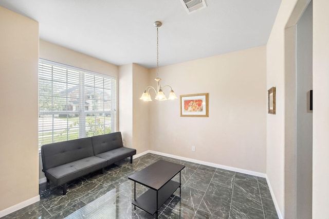 living room featuring a chandelier