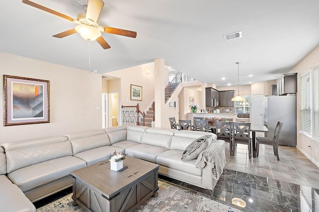 living room with ceiling fan