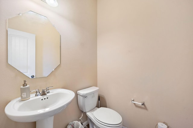 bathroom with toilet and sink