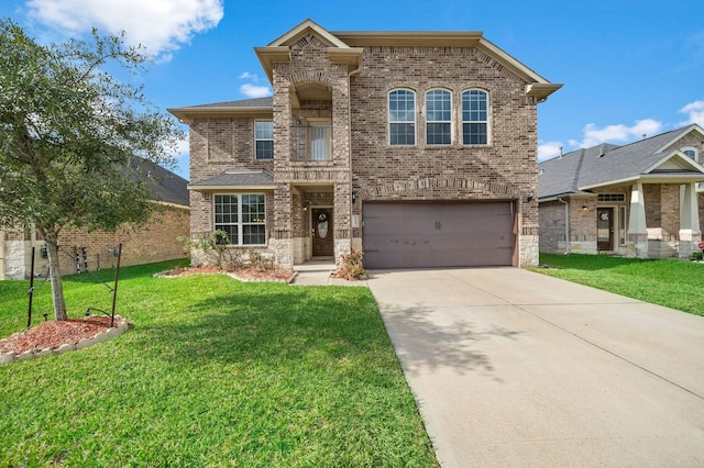 view of front of property with a garage and a front yard