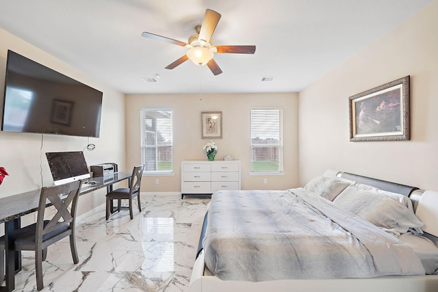 bedroom featuring multiple windows and ceiling fan