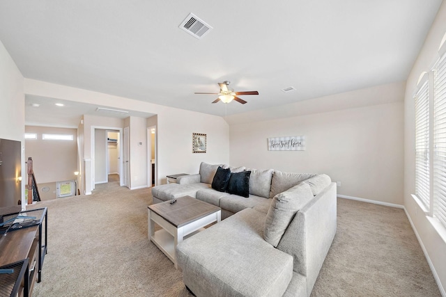 living room with light carpet and ceiling fan