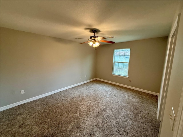 empty room with a textured ceiling, carpet floors, and ceiling fan