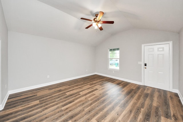 interior space featuring dark wood-type flooring, ceiling fan, and lofted ceiling