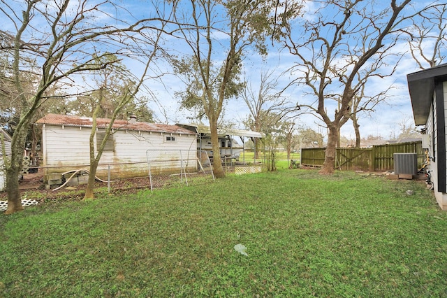 view of yard with central AC unit