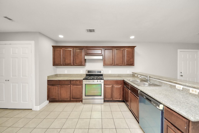 kitchen with stainless steel appliances, sink, and light tile patterned floors