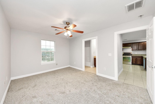 carpeted empty room with ceiling fan